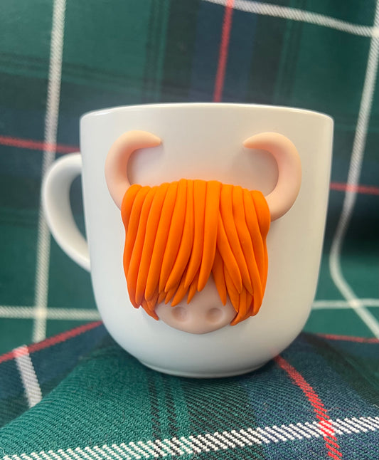 Orange highland coo mug
